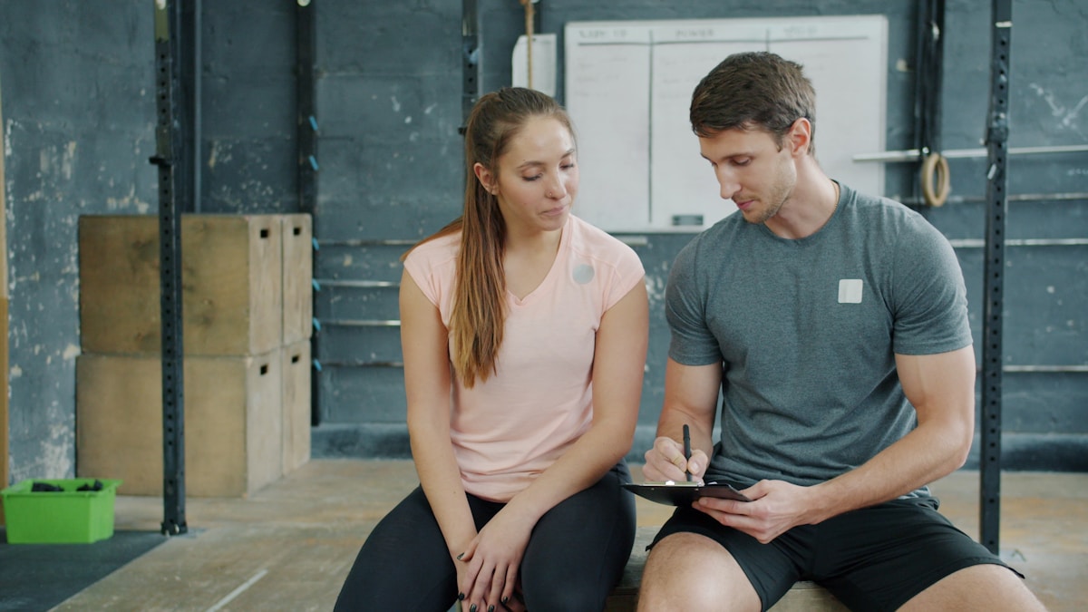 Coach and member reviewing a personalized training plan together