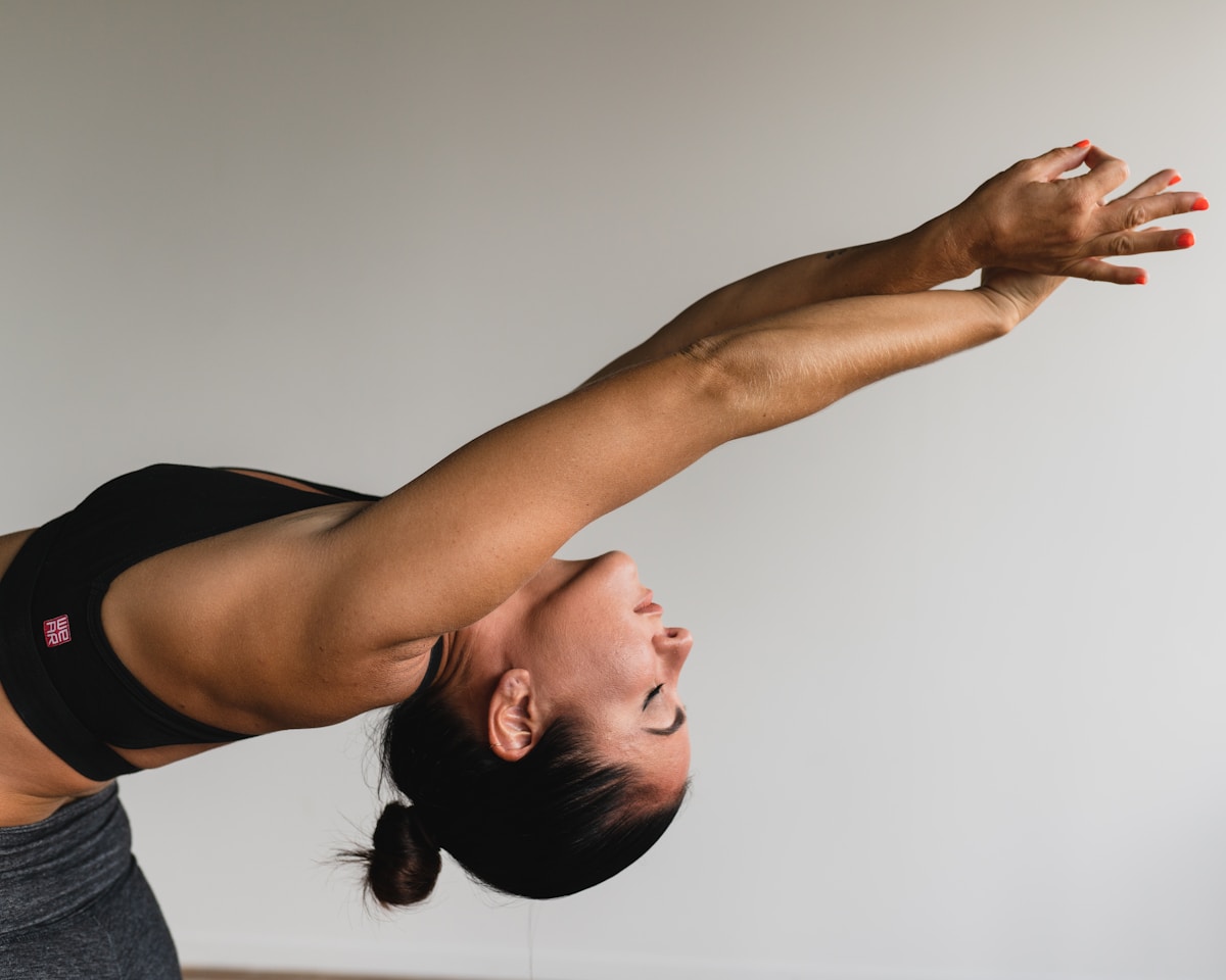 Member in a deep stretch during a recovery and mobility session