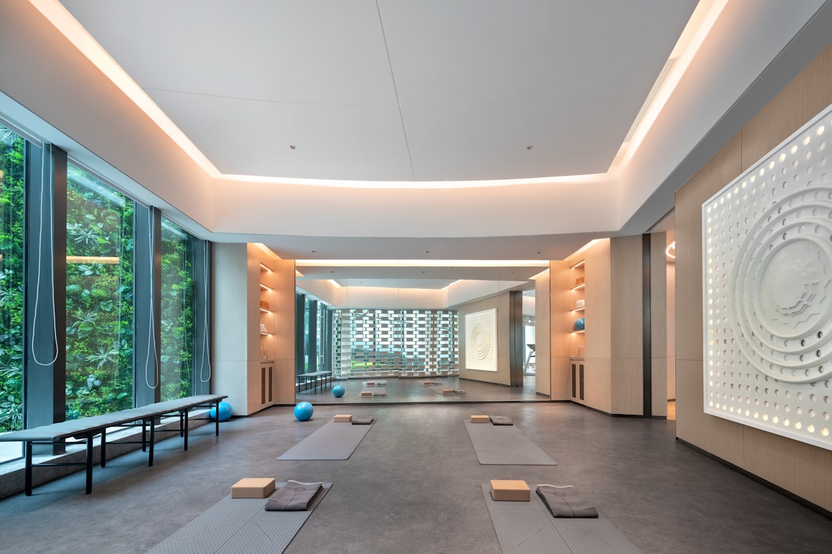 Bright boutique studio with yoga mats, natural light, and calm coastal energy